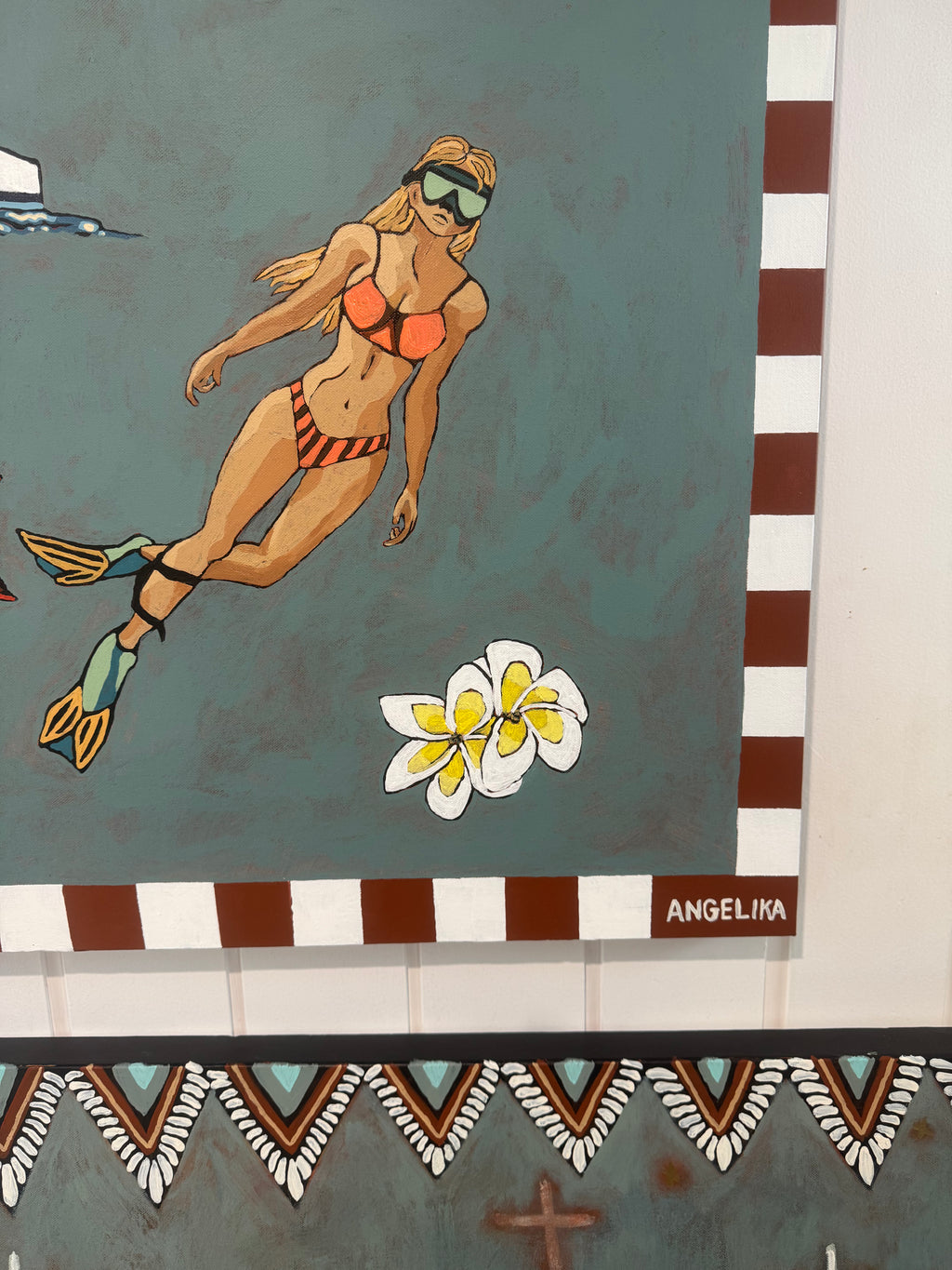 Artistic depiction of a swimmer with snorkel and flippers on a green background, featuring the artist's signature 'Angelika'.